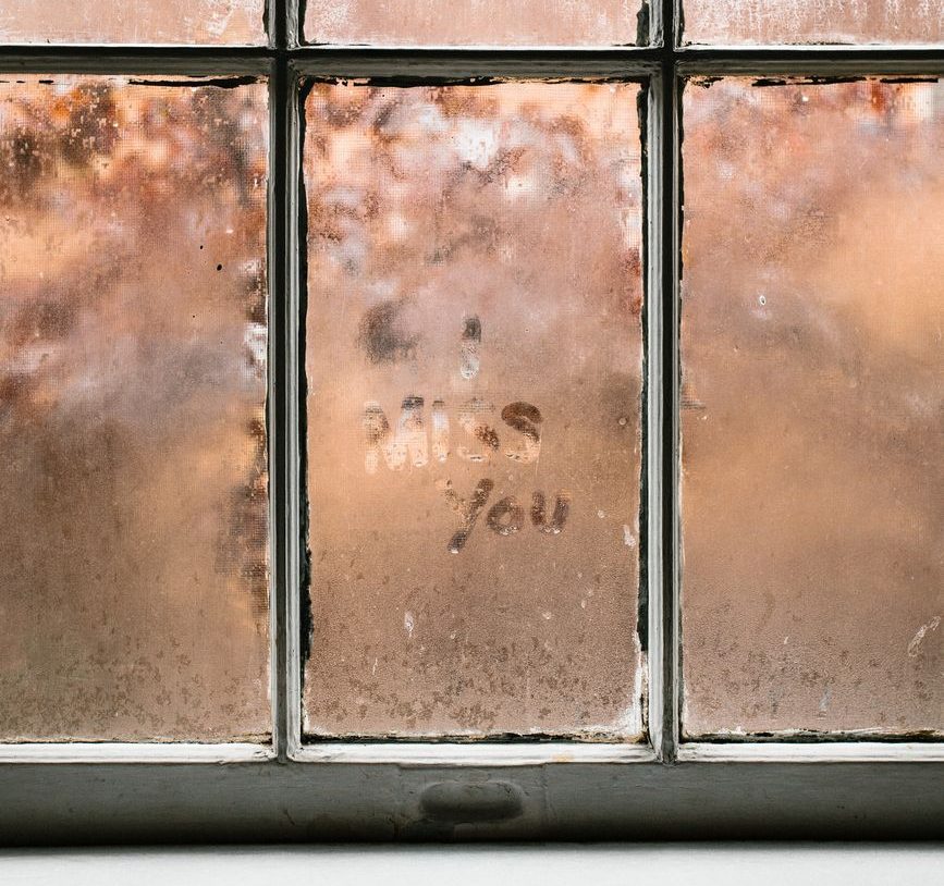 I Miss You Written on Window Image